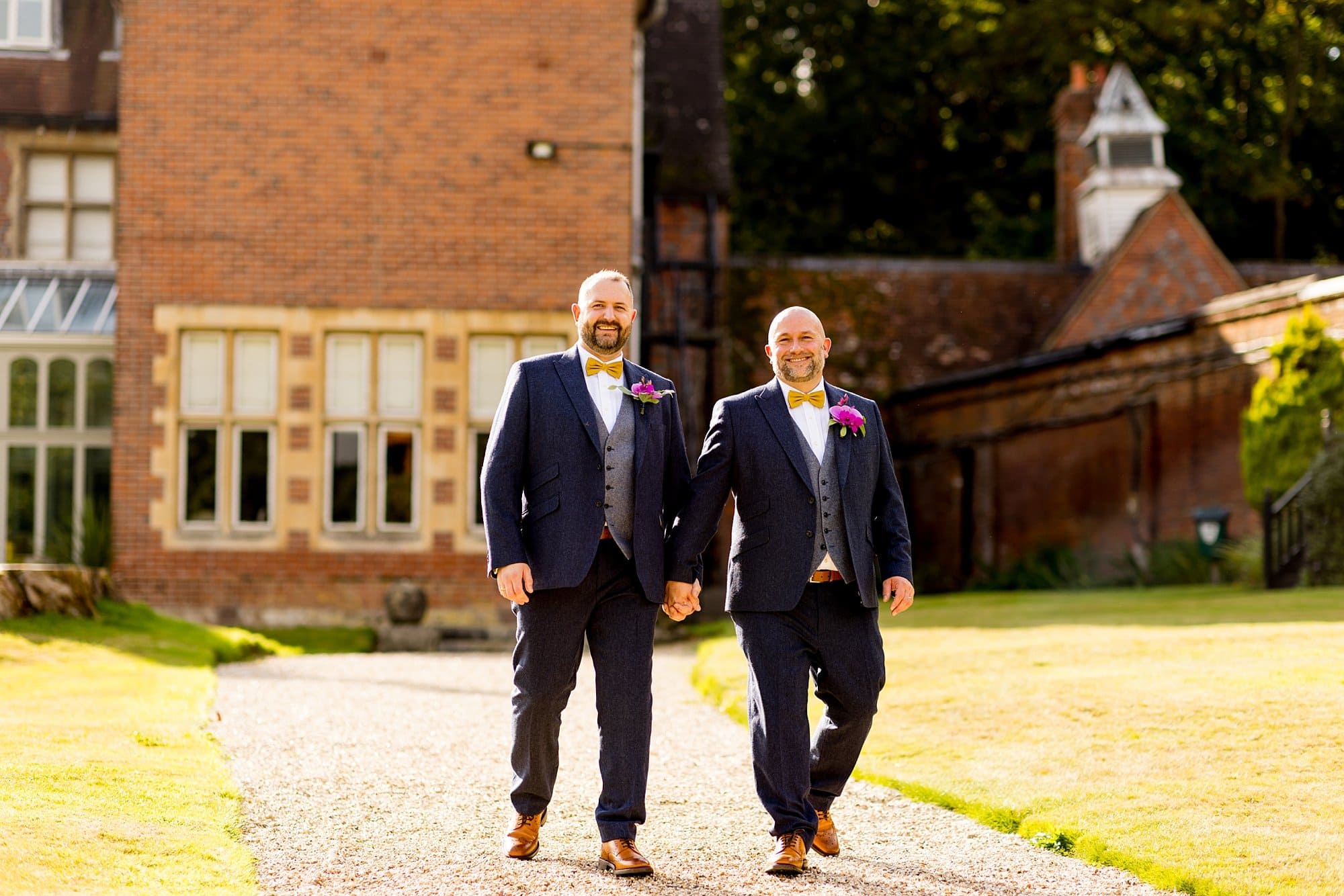 burley manor grounds lgbtq wedding navy tweed suit gret waistcoat mustard yellow bow tie