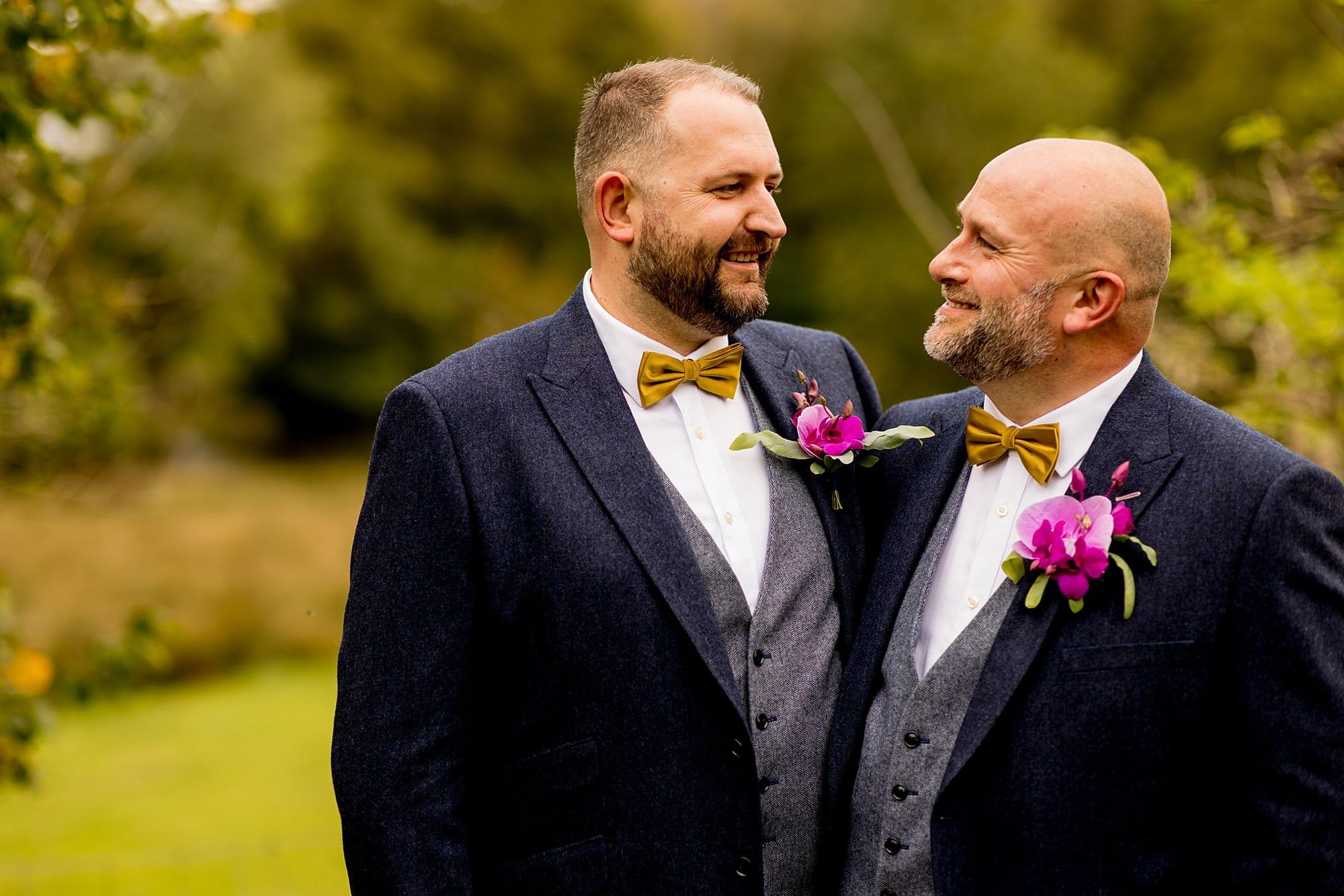 burley manor lgbtq wedding navy tweed suit gret waistcoat mustard yellow bow tie