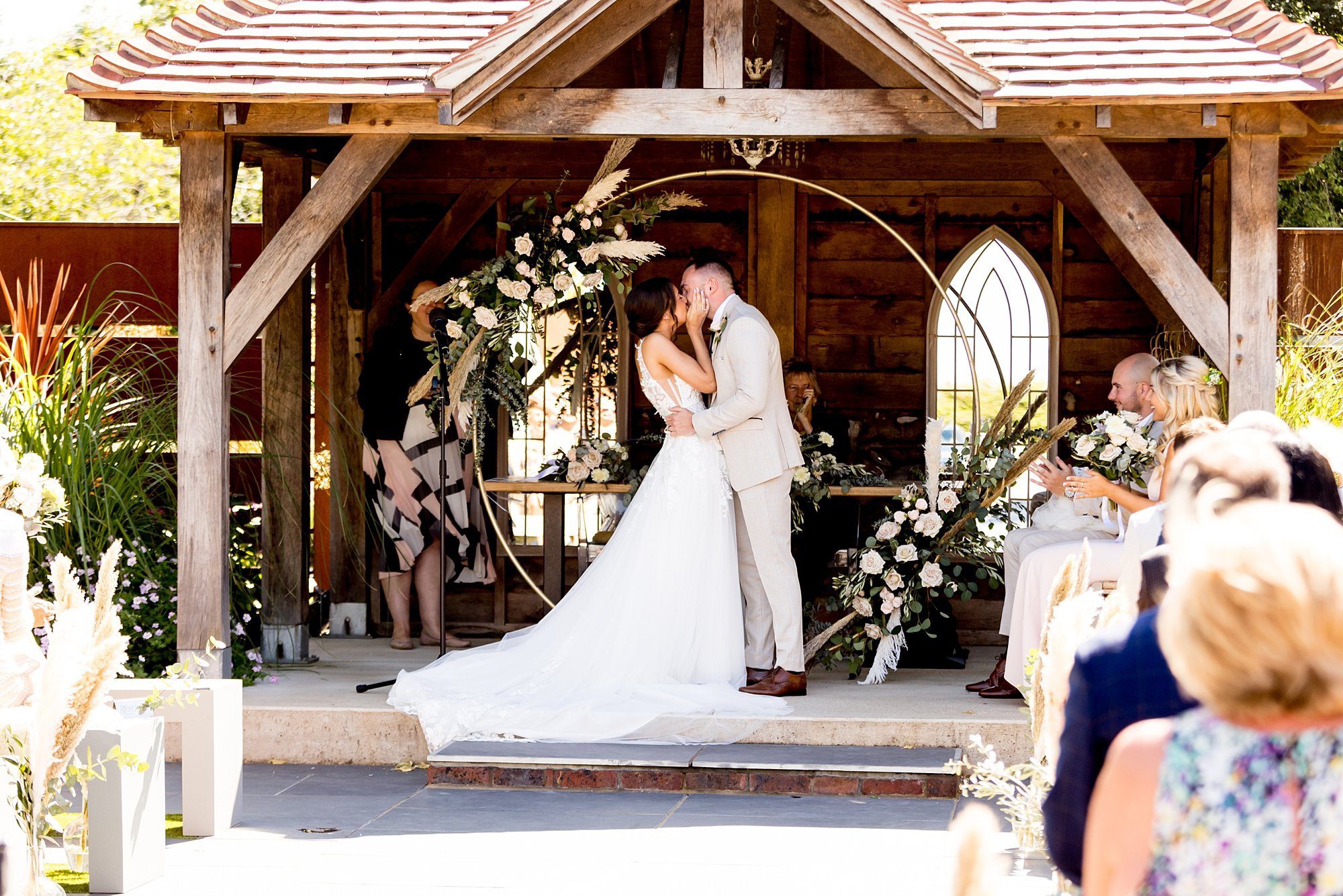 chic styled wedding southend barns ceremony pastel rose pampas grass circular wedding arch