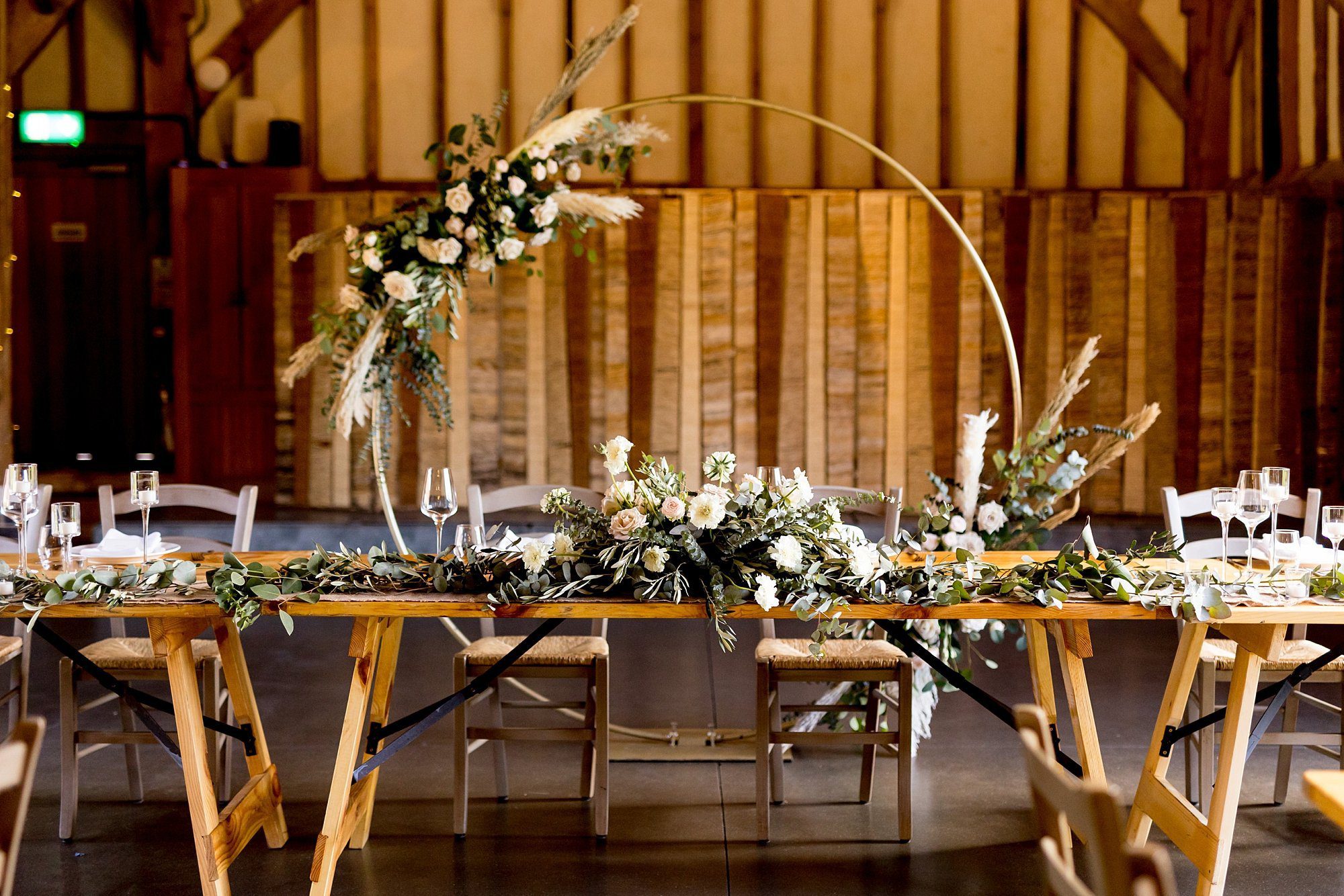 chic styled wedding southend barns pastel rose pampas grass circular wedding arch