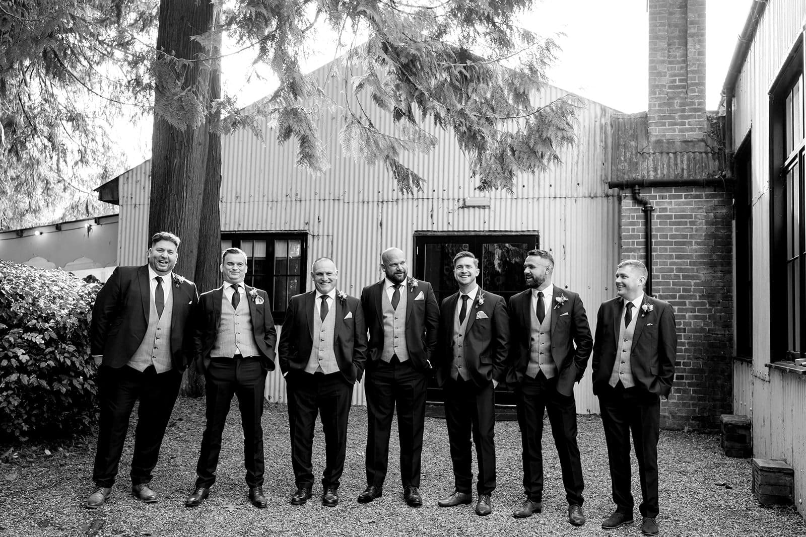 Groomsmen group photo at wedding venue