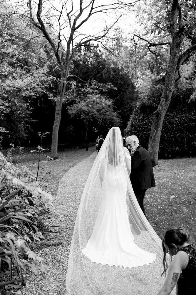 Bride walking to wedding ceremony