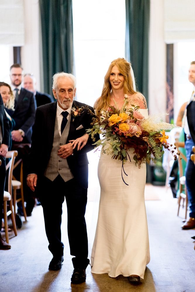 Bride walking down the aisle at wedding ceremony
