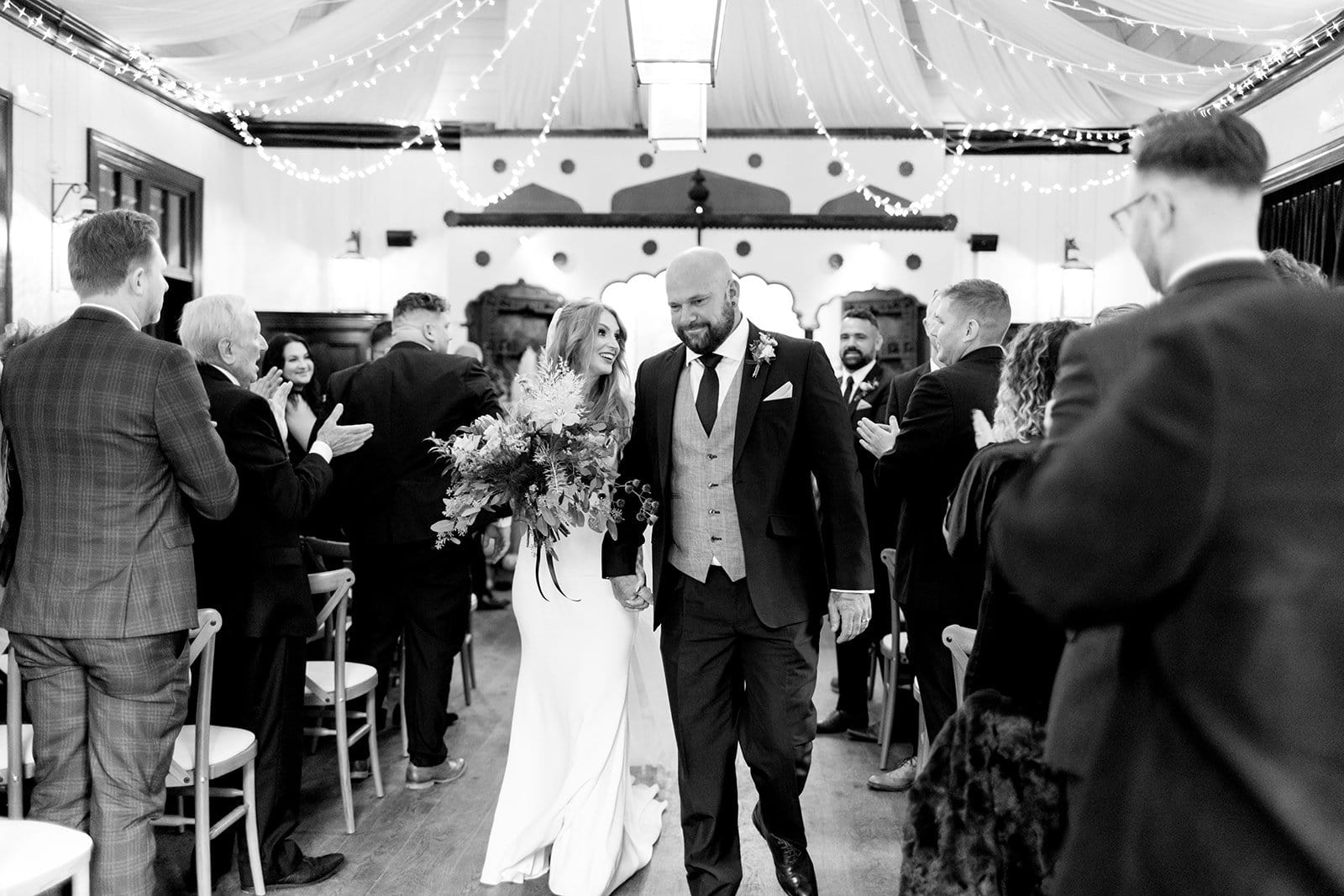Newlyweds at wedding ceremony at Larmer Tree