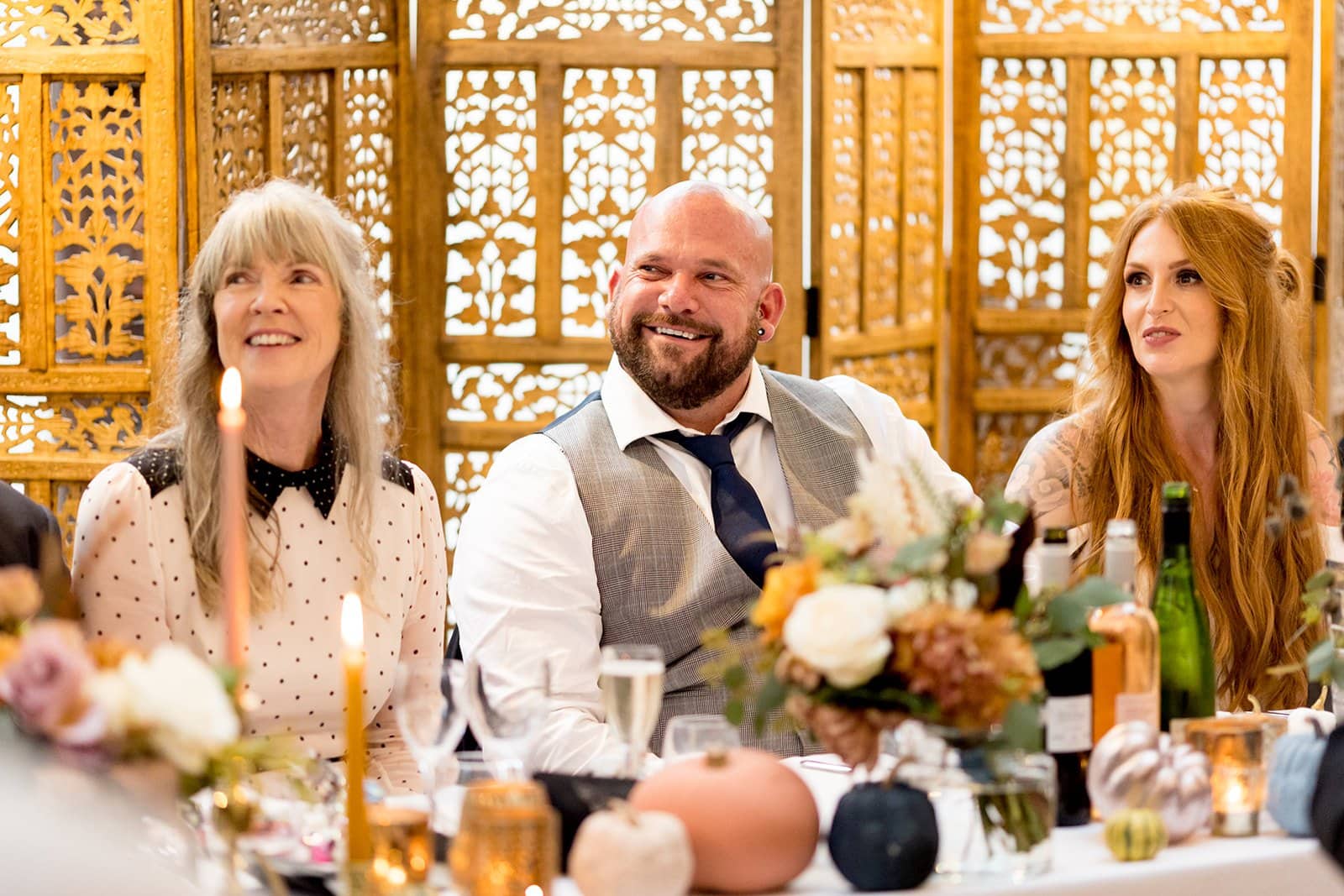 Wedding couple listening to wedding speeches