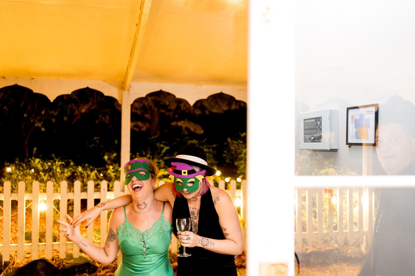 Wedding reception guests with masks for photobooth
