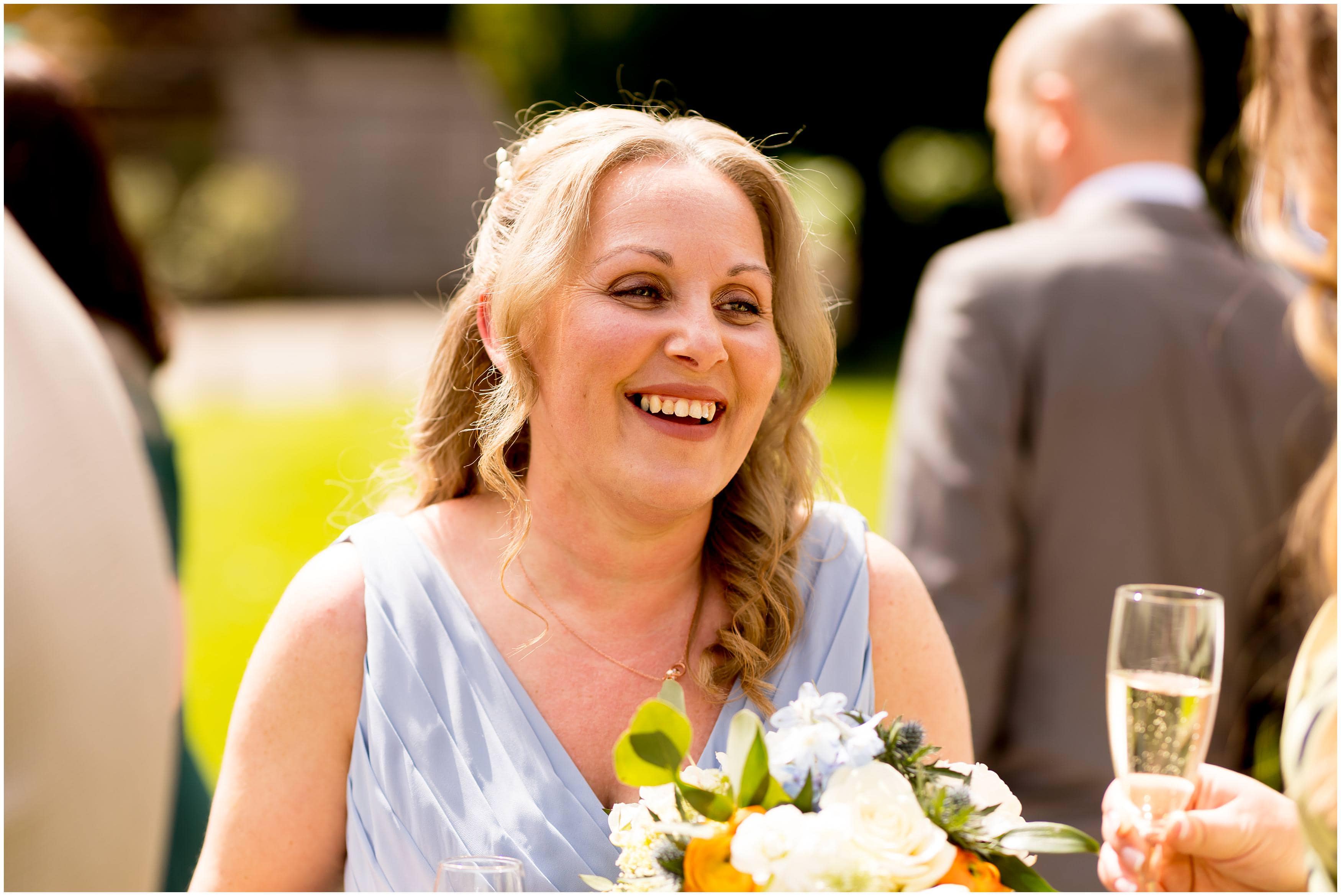 Bridesmaid wearing pale blue bridesmaid dress