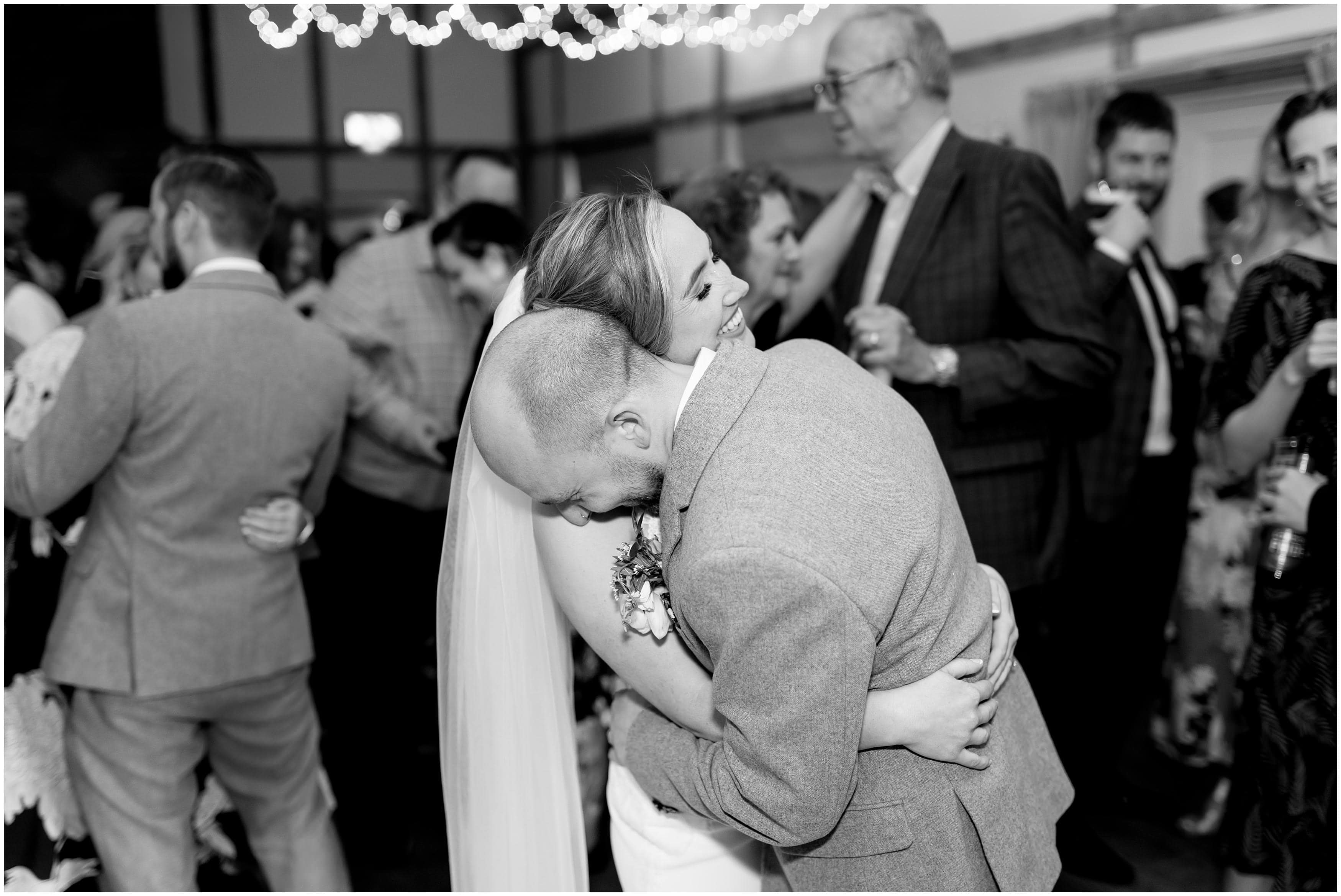 Wedding couple laughing at wedding reception at Burley Manor