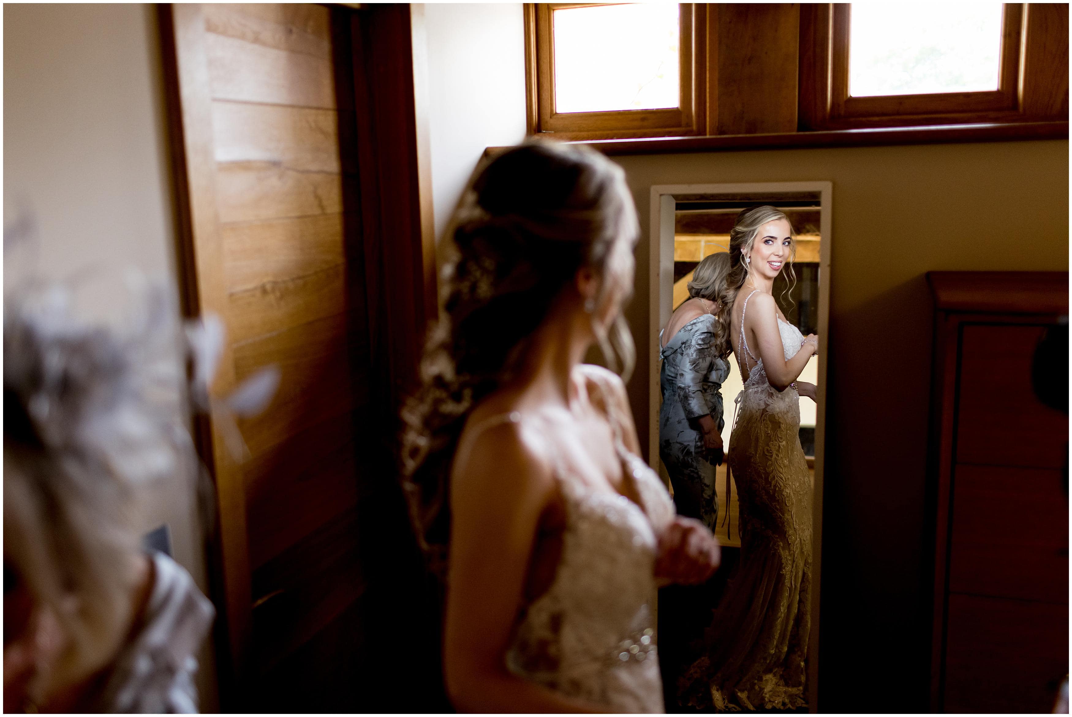 Bride wearing lace and beaded wedding dress on wedding day