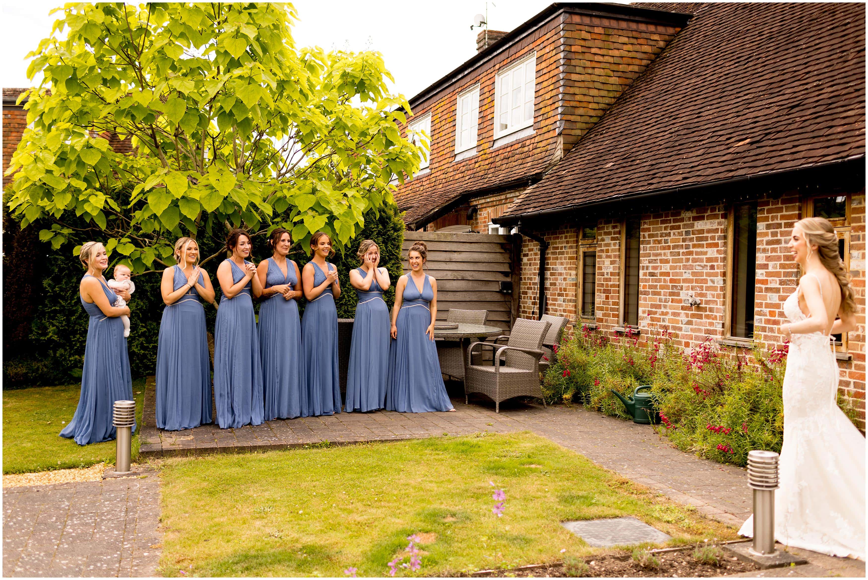 Bridesmaids first look at bride on wedding day
