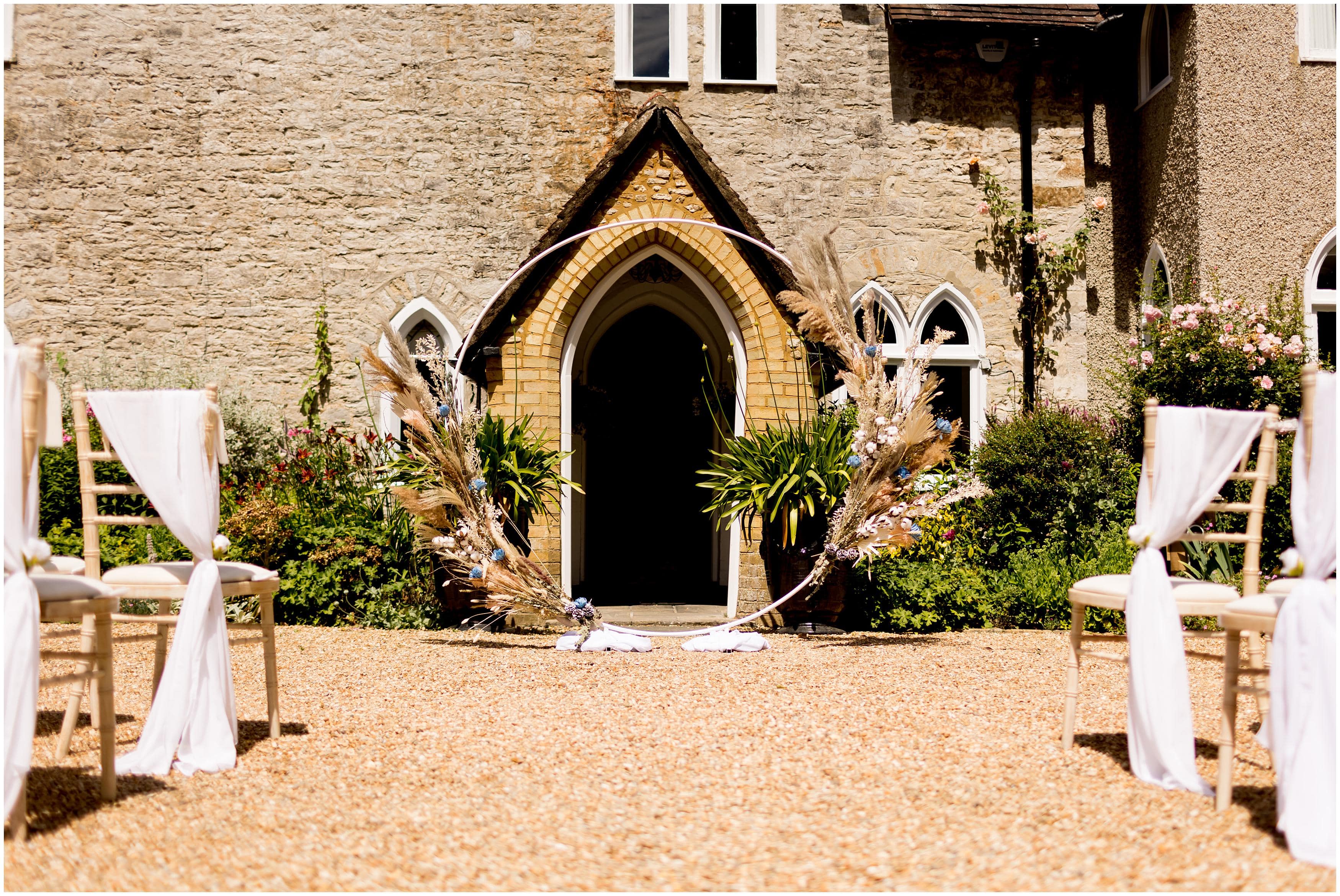 Elegant boho wedding arch decor at Bradgate Manor