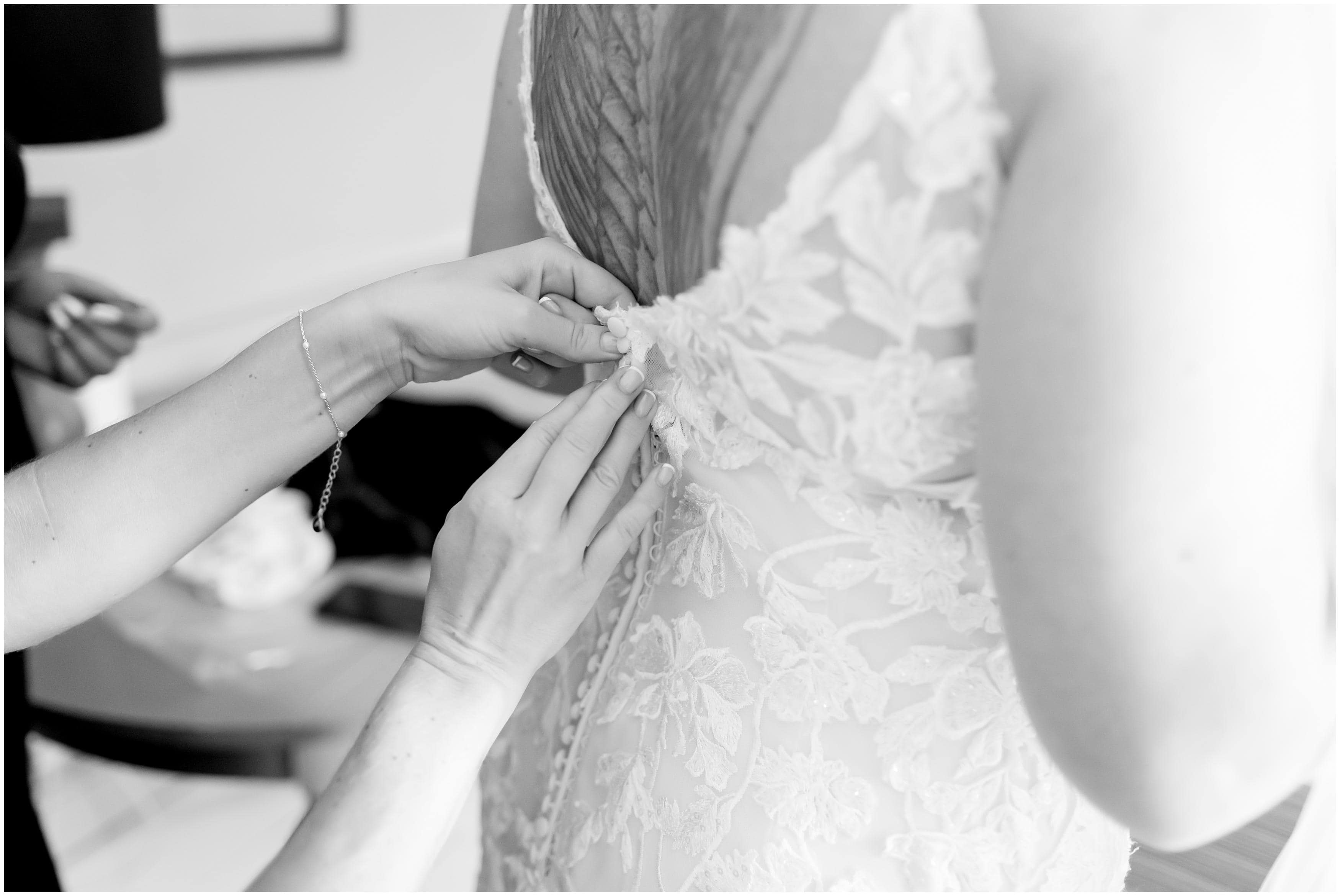 bride getting dress on at deans court