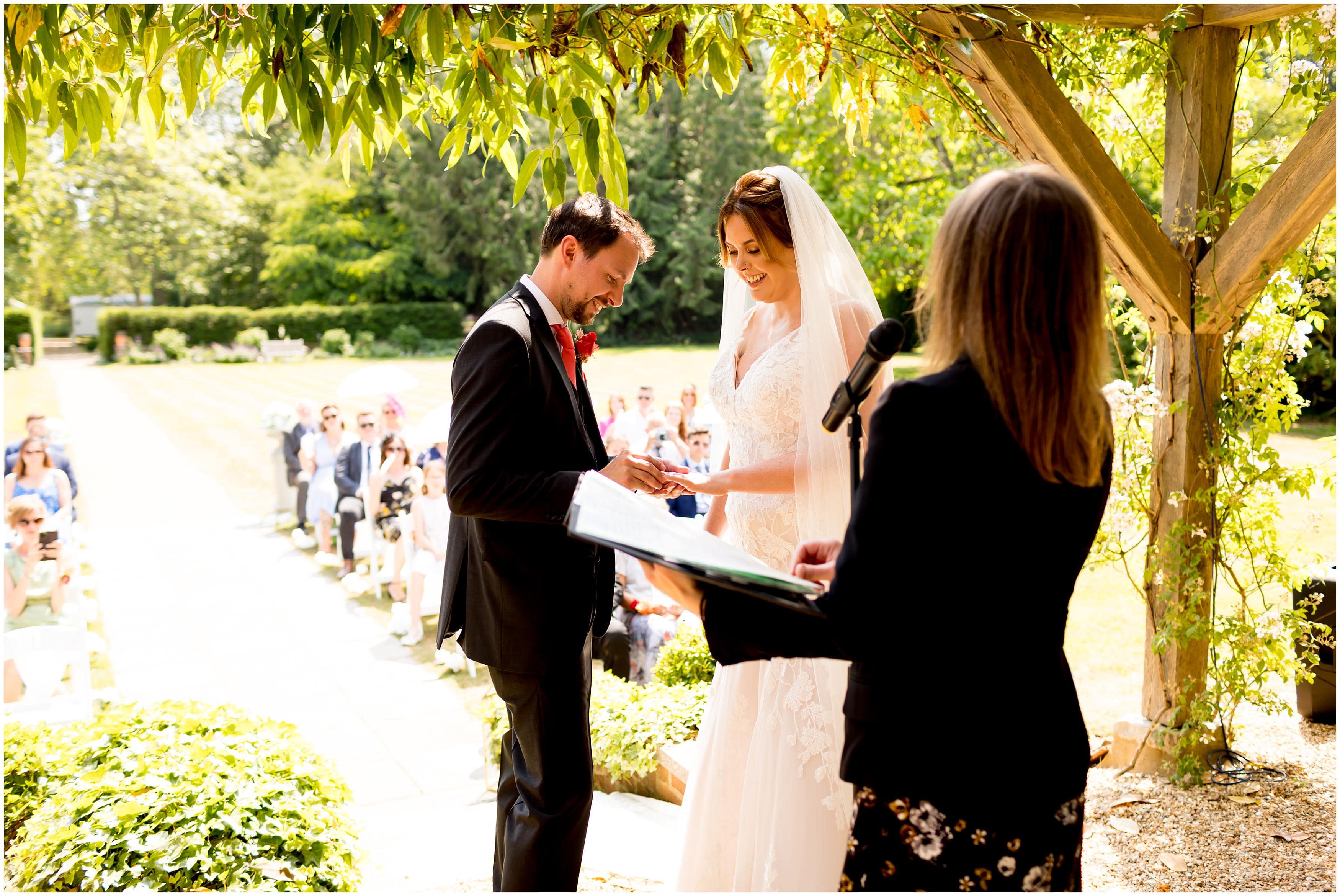 exchanging wedding rings in wedding ceremony