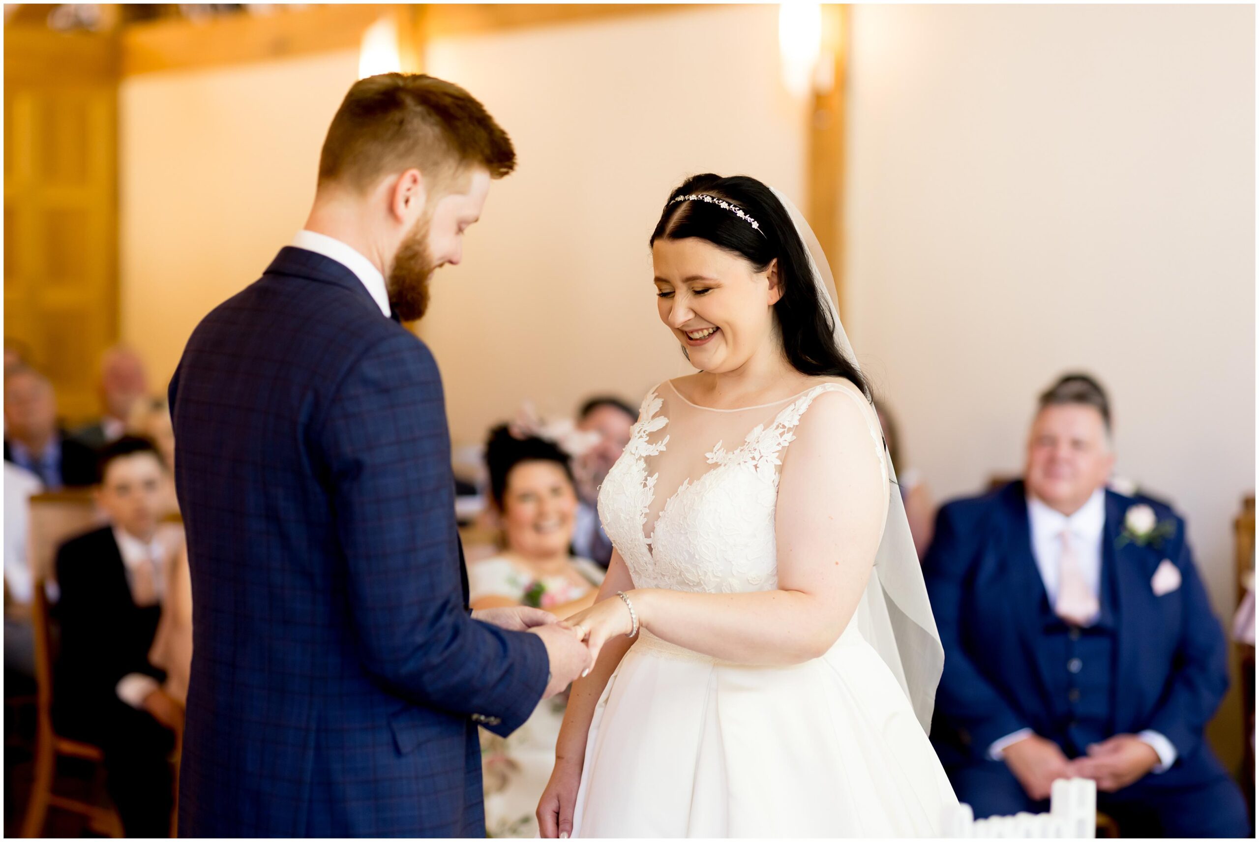 bride and groom exchanging wedding rings